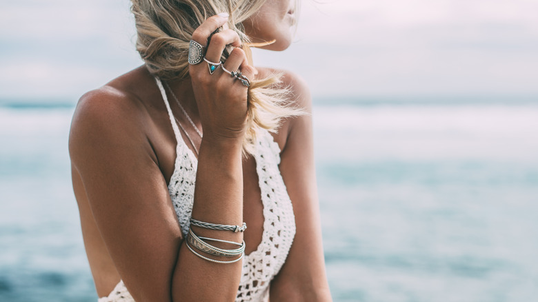woman wearing jewelry on beach