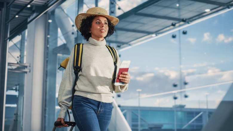 Person in airport with passport