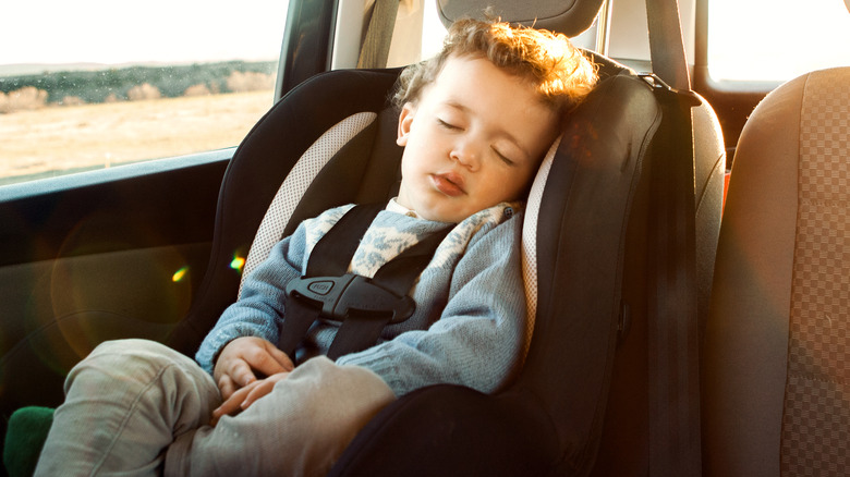 Child sleeping in car seat