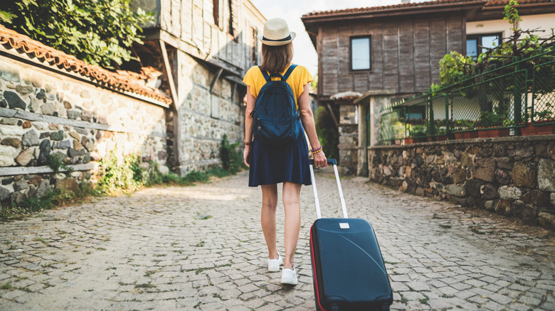 traveler walking with suitcase
