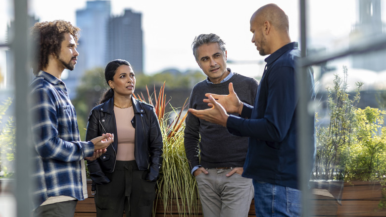 group of people having a conversational outdoors