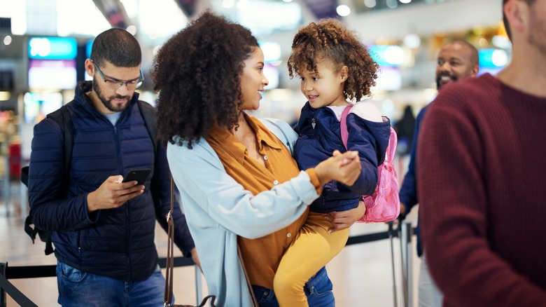 parent in child at the airport