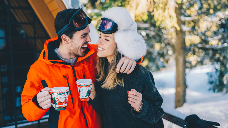 Couple laughing in ski gear