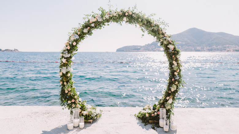 flower arch by the ocean