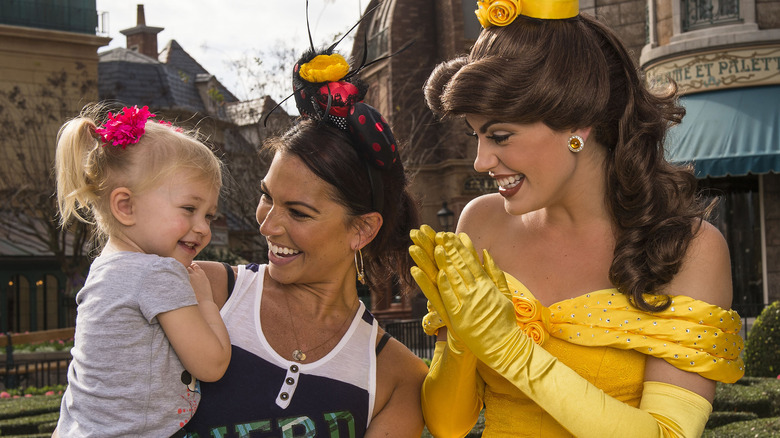 Belle with Disney park visitors 