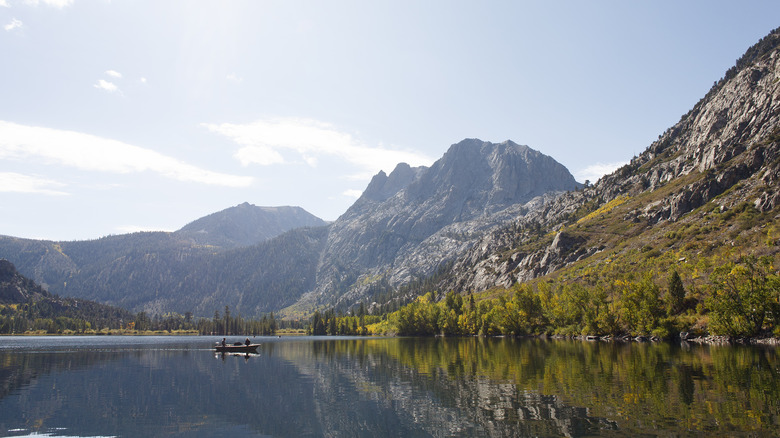 Boat on lake with mountain view in background