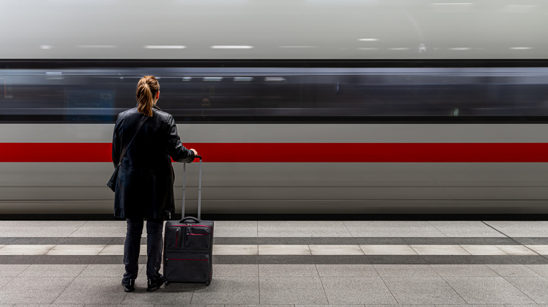 A woman waiting for a high speed train in Berlin