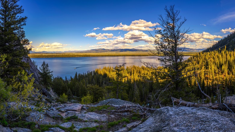 Sunset over the mountains, forest, and waters around Jenny Lake Loop hiking trail at Grand Teton National Park