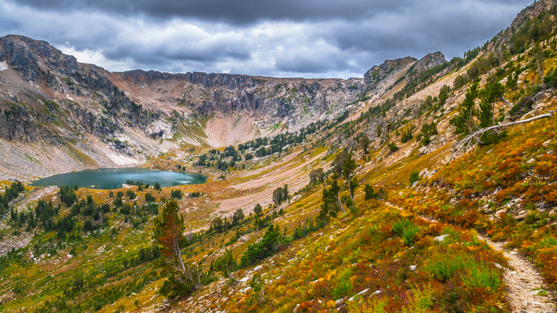 A hiking trail on the mountainside overlooking Lake Solitude near Paintbrush Divide at Grand Teton National Park