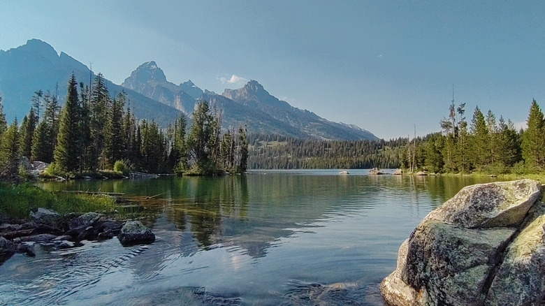 Mountains and forest surrounding Taggart Lake Loop hiking trail at Grand Teton National Park