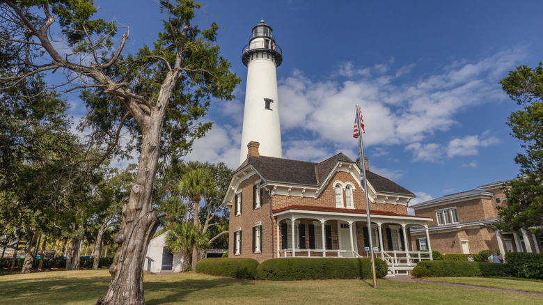 A historic building and lighthouse on St. Simons Island.
