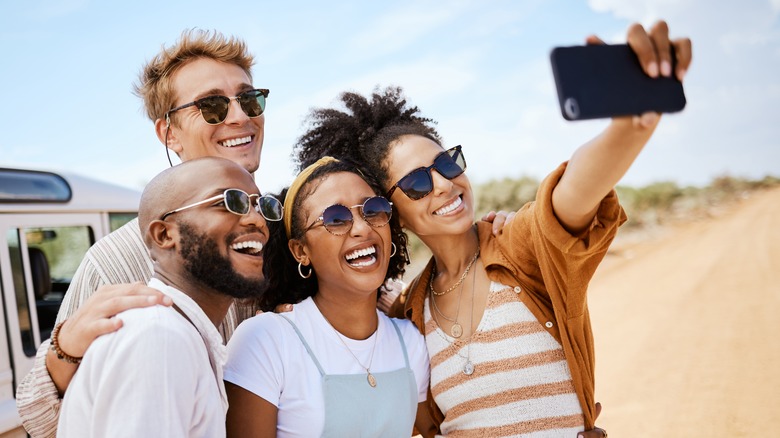 Diverse group selfie on safari