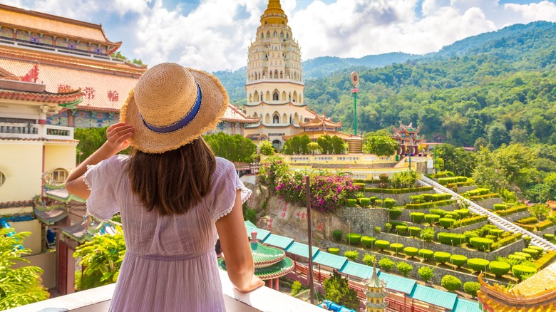 Traveler overlooking religious temple