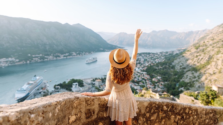 Solo female traveller looking out over Italian scene