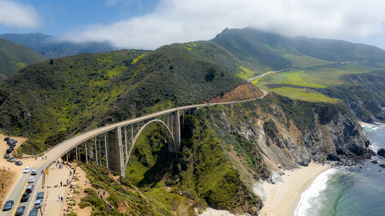 A highway runs along the mountainous coast of Big Sur, California