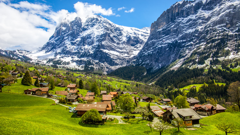 The mountains towering over the small village of Grindelwald in Switzerland