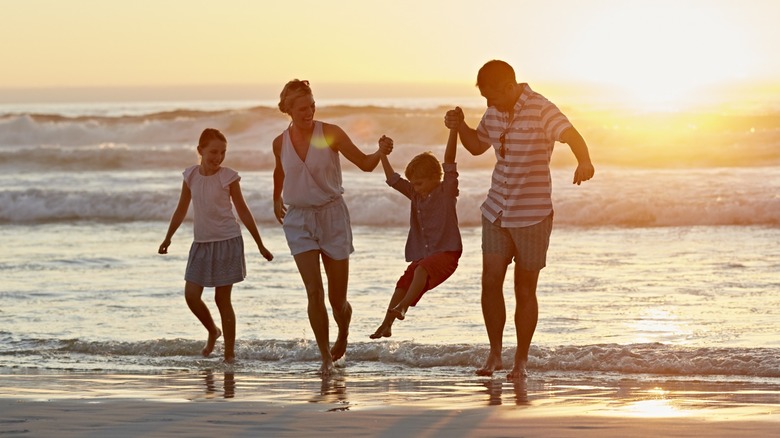Family playing on a beach