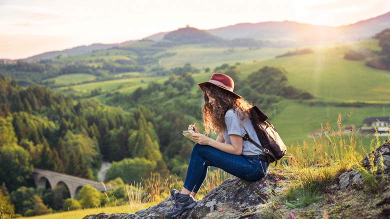 traveler journaling in nature