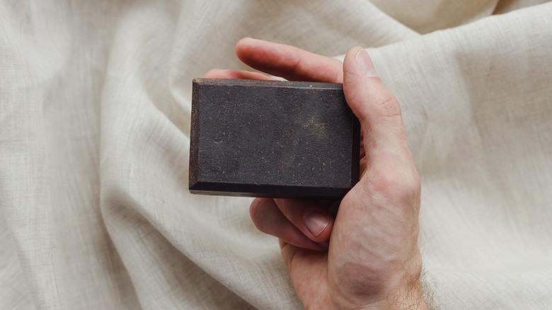 hand holding bar of soap