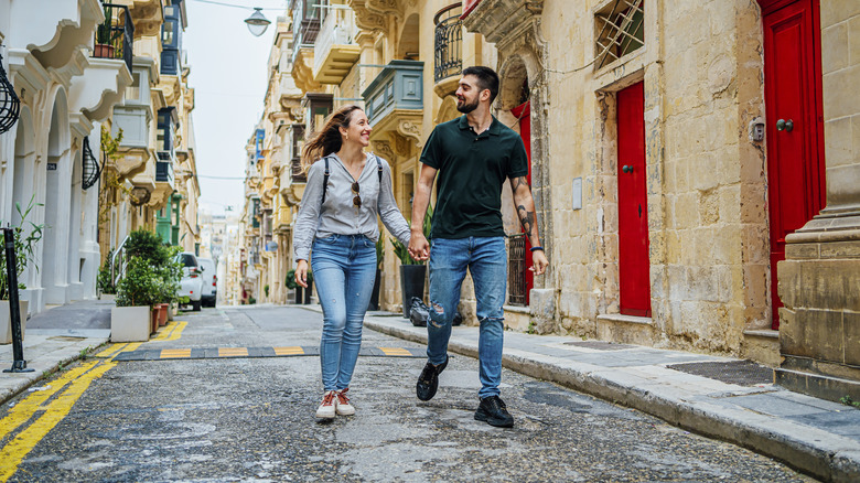 Couple holding hands European street