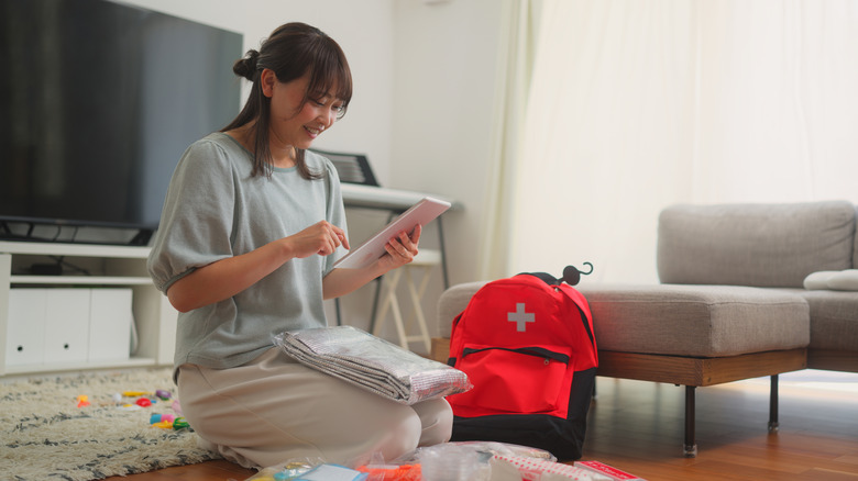 Woman preparing first aid kit