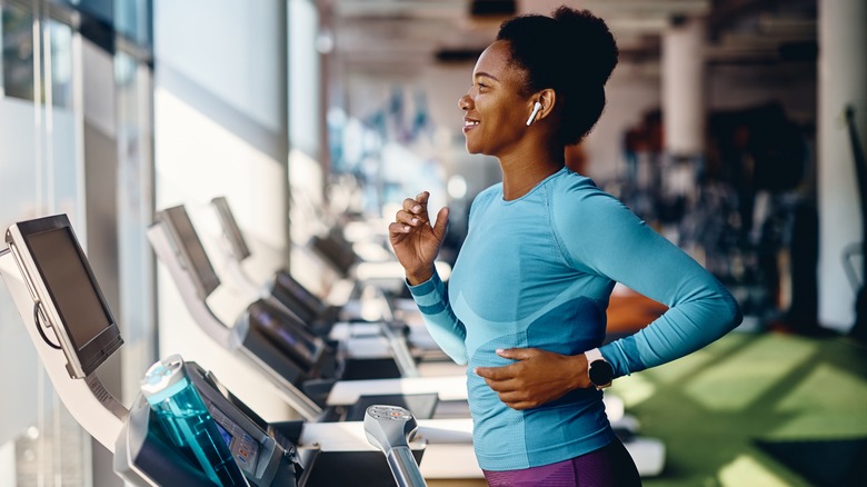 Smiling woman on treadmill