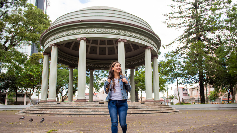 woman walking next to gazebo