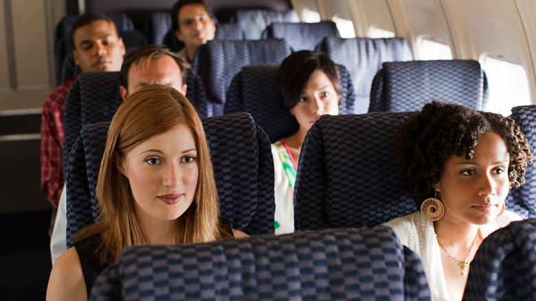 passengers in plane cabin
