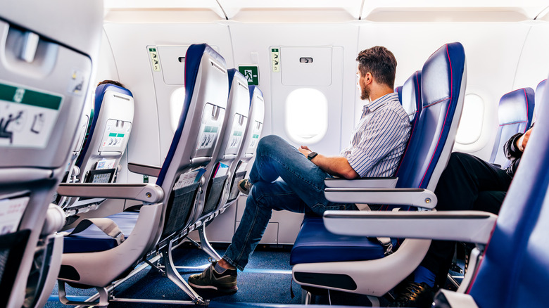 man sitting on plane