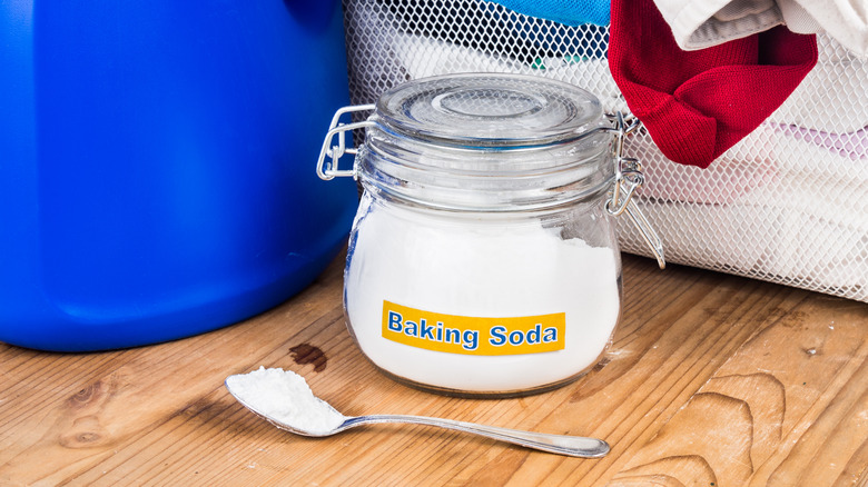 jar of baking soda with laundry