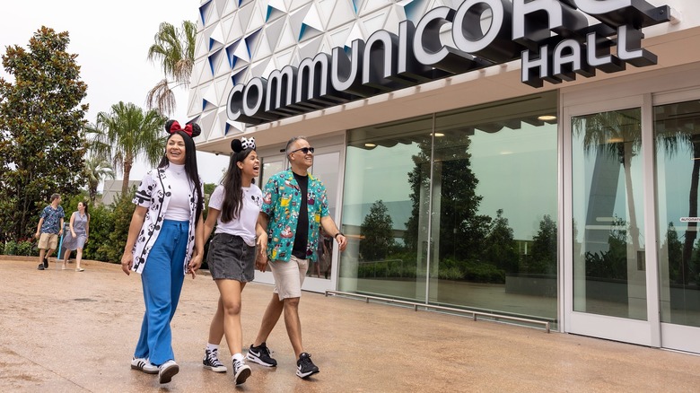 Disney park visitors walking through Epcot