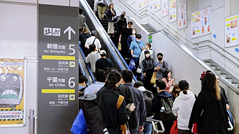An escalator full of people in Tokyo
