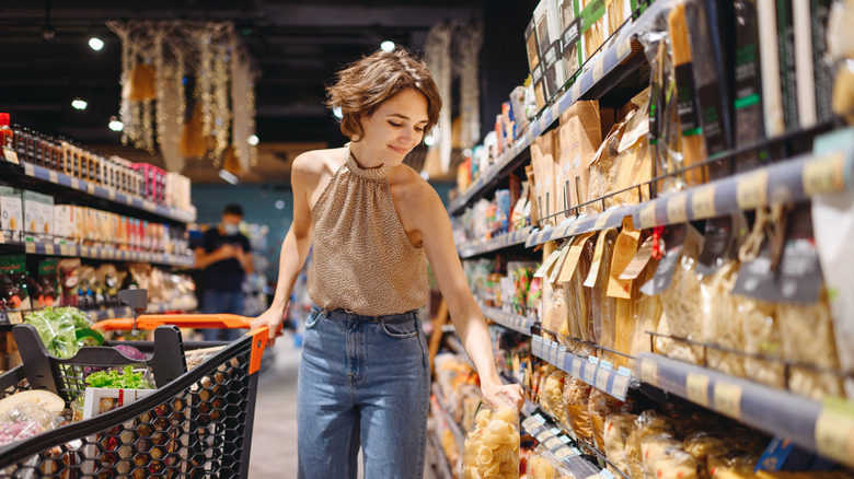 woman shopping in pasta aisle 