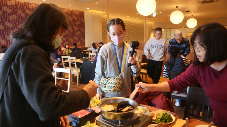 people dining at a restaurant in Japan