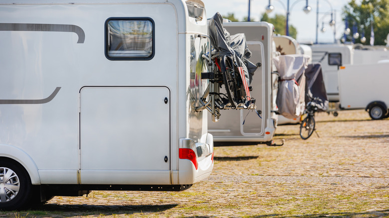 Row of RVs parked at campsite