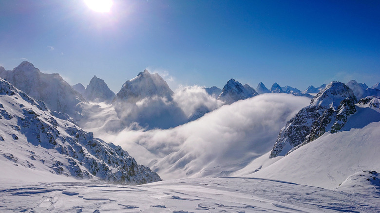 Breathtaking view of the snowy Canadian Rocky Mountains and valley on a sunny winter day