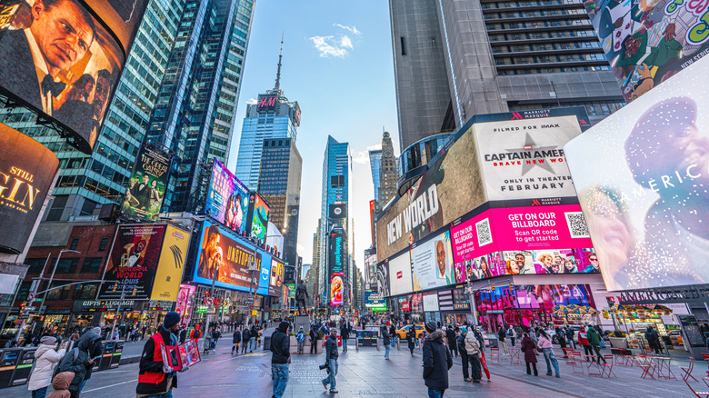 Tourists walking through Times Square