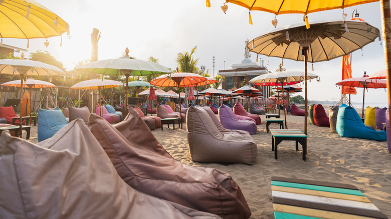 Empty bar chairs on Bali, Indonesia's Seminyak Beach