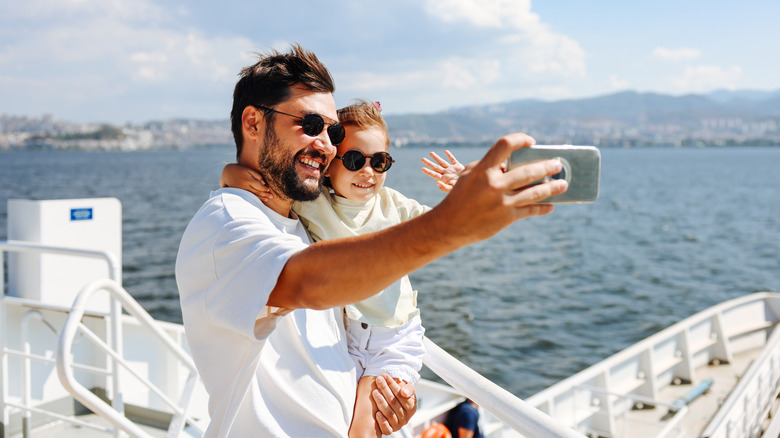 Family taking a selfie on cruise deck