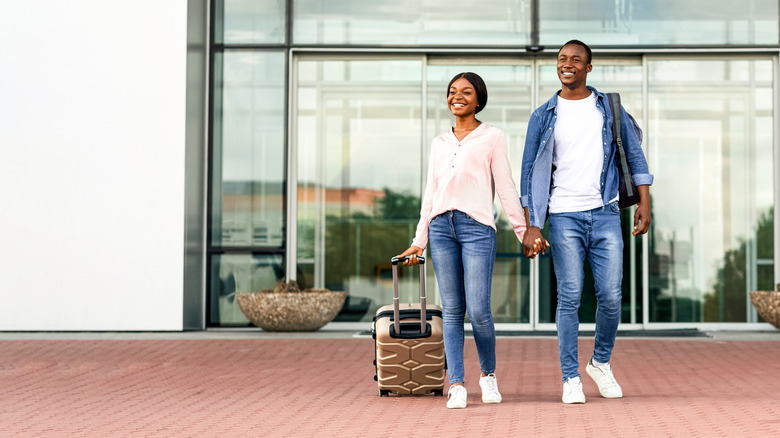 travelers leaving airport