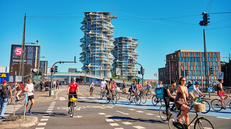 People cycling through the eco-friendly streets of Copenhagen in Denmark