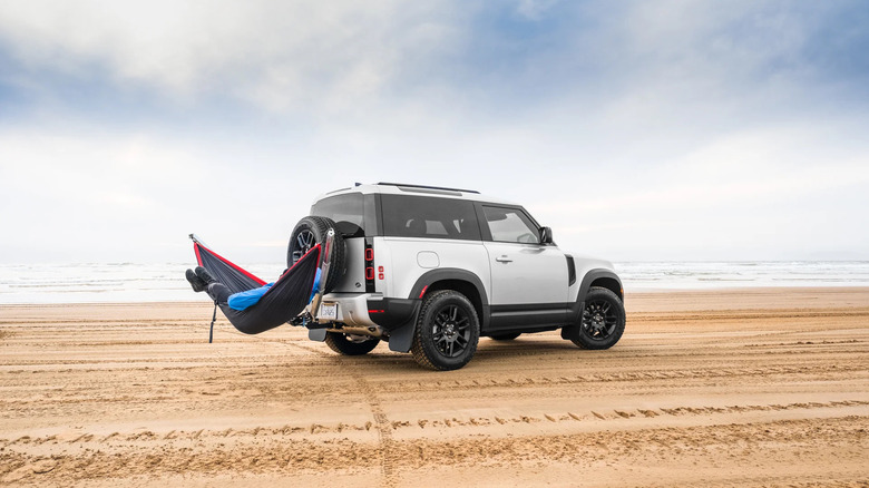 The adventure hammock on the back of a car on a beach