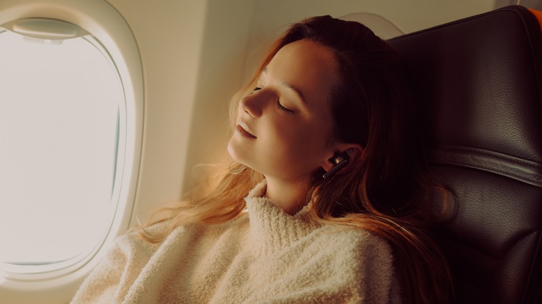 Airplane passenger sleeping peacefully
