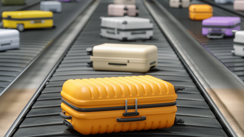 Colorful Suitcases on Airport Baggage Carousel