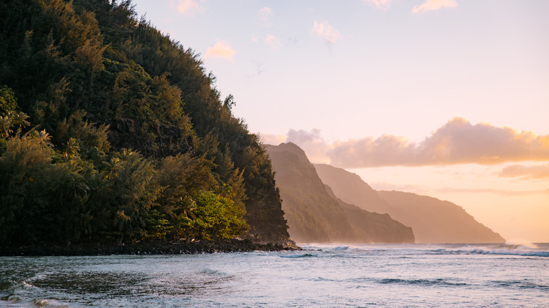 Aerial views of the cliffs where the Pacific Ocean meets the Nā Pali Coast on Kauai