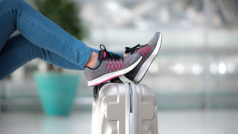 Woman wearing runners in airport