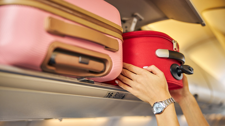 Woman putting bag up