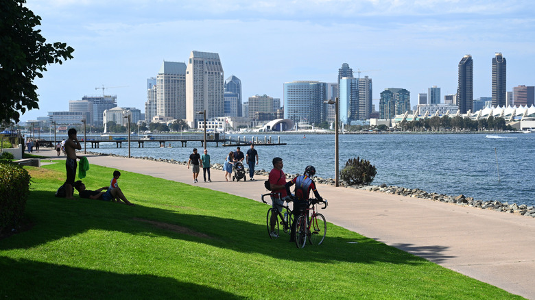 Cyclists and pedestrians enjoying view of San Diego skyline from Tidelands Park