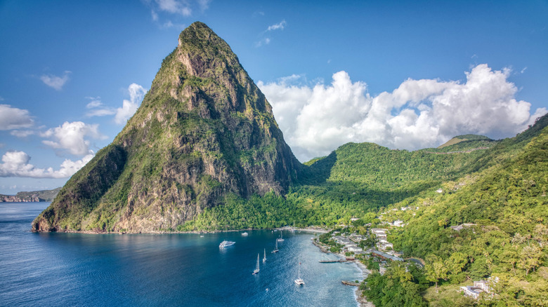 Aerial panoramic view of Sugar Beach and the Val des Pitons mountains in Soufriere, Saint Lucia