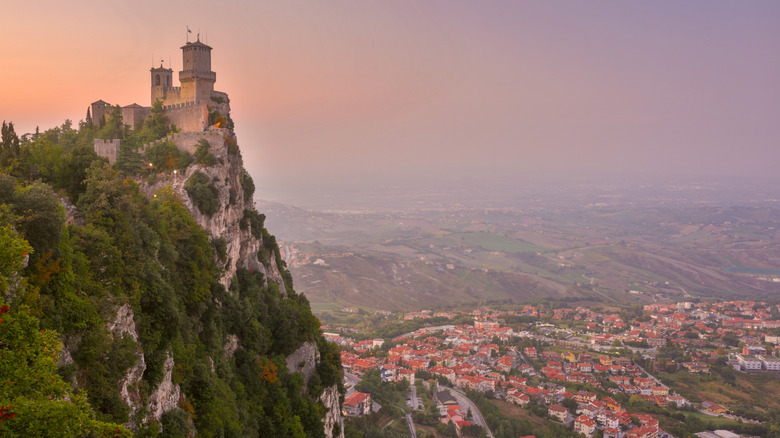 Guaita Fortress on Mount Titano at sunset overlooking San Marino City and surrounding landscape in San Marino